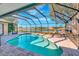 Screened-in pool with a stunning view of the lake, perfect for relaxation and entertaining at 2321 Sofia Ln, Punta Gorda, FL 33983