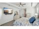 Large bedroom with a king bed, dresser, and TV at 2750 W Marion Ave, Punta Gorda, FL 33950