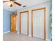 Bedroom with light blue walls and double closets at 3362 Rogue St, North Port, FL 34291