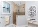 Bathroom boasts a walk-in shower, tile flooring and a decorative wall accent at 386 Royal Poinciana, Punta Gorda, FL 33955