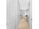 Elegant bathroom hall with neutral color scheme and access to the Primary bathroom at 386 Royal Poinciana, Punta Gorda, FL 33955