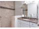 Modern bathroom with a walk-in shower, granite countertop, and neutral tile at 386 Royal Poinciana, Punta Gorda, FL 33955