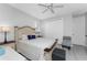 Light and airy bedroom with a wooden bed frame and en-suite bathroom at 386 Royal Poinciana, Punta Gorda, FL 33955
