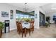 Bright dining area with a table for four and views of the backyard at 386 Royal Poinciana, Punta Gorda, FL 33955
