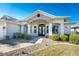 Front view of the house, showcasing its stone accents and landscaping at 386 Royal Poinciana, Punta Gorda, FL 33955