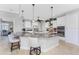 Modern kitchen with white cabinets, granite countertops, and island seating at 386 Royal Poinciana, Punta Gorda, FL 33955