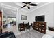 Home office with built-in shelving, desk, and comfortable seating at 386 Royal Poinciana, Punta Gorda, FL 33955