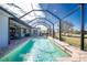 Inviting swimming pool with a screened enclosure and a spacious backyard at 386 Royal Poinciana, Punta Gorda, FL 33955