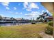 Landscaped backyard with canal access and dock at 3918 La Costa Island Ct, Punta Gorda, FL 33950