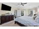 Main bedroom with king bed and large TV at 40 Tee View Ct, Rotonda West, FL 33947