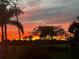 Vibrant sunset view over tranquil landscape, creating a serene ambiance at 40 Tee View Ct, Rotonda West, FL 33947