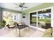 Bright and airy screened patio with seating and lovely view at 5121 Raven St, North Port, FL 34286