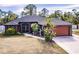 Single-story house with a large yard and two-car garage at 5188 Balmor Ter, North Port, FL 34288