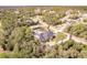 Aerial view showing house, pool, and large backyard at 5188 Balmor Ter, North Port, FL 34288
