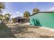 View of the backyard with a green shed and pool at 5188 Balmor Ter, North Port, FL 34288