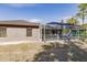 Home's back with pool and screened enclosure at 5188 Balmor Ter, North Port, FL 34288