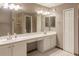 Double vanity bathroom with a large mirror and tile floors at 5188 Balmor Ter, North Port, FL 34288