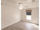 Bright bedroom featuring wood-look floors and a ceiling fan at 5188 Balmor Ter, North Port, FL 34288