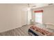 Bedroom with ceiling fan, window, and wood-look floors at 5188 Balmor Ter, North Port, FL 34288