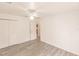 Bright bedroom with double doors and wood-look flooring at 5188 Balmor Ter, North Port, FL 34288