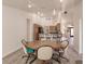 Open dining area with kitchen and living room access at 5188 Balmor Ter, North Port, FL 34288