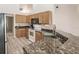 Kitchen boasts granite countertops and ample cabinetry at 5188 Balmor Ter, North Port, FL 34288