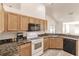 Bright kitchen with granite countertops and modern appliances at 5188 Balmor Ter, North Port, FL 34288