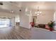 Bright living room with vaulted ceiling, hardwood floors, and view of pool at 5188 Balmor Ter, North Port, FL 34288