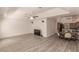 Open living room with hardwood floors and a view of the kitchen at 5188 Balmor Ter, North Port, FL 34288