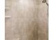 Shower with beige tile and built-in shelves at 5188 Balmor Ter, North Port, FL 34288
