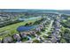 Aerial view of community, showing homes and golf course at 8382 Creekview Ln, Englewood, FL 34224