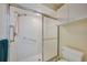 Shower stall with grab bars and a toilet at 8382 Creekview Ln, Englewood, FL 34224