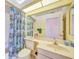 Small bathroom with shower/tub combo and vanity at 8382 Creekview Ln, Englewood, FL 34224