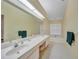 Double vanity bathroom with a large soaking tub and separate shower at 8382 Creekview Ln, Englewood, FL 34224