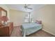 Bright bedroom with a single bed and dresser at 8382 Creekview Ln, Englewood, FL 34224
