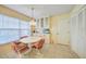 Kitchen breakfast nook with white cabinets and a round table at 8382 Creekview Ln, Englewood, FL 34224