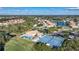 Community pool and tennis courts near clubhouse at 8382 Creekview Ln, Englewood, FL 34224