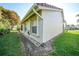 Well-maintained house exterior with manicured lawn at 8382 Creekview Ln, Englewood, FL 34224