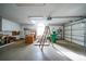Spacious garage with ample storage and a workbench at 8382 Creekview Ln, Englewood, FL 34224