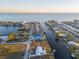 Aerial view of waterfront property with canal access and nearby homes at 174 Severin Se Rd, Port Charlotte, FL 33952