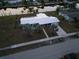 Single-story home with pool, canal views, and lush landscaping at 174 Severin Se Rd, Port Charlotte, FL 33952