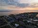 Wide aerial showcasing waterfront community at sunset at 174 Severin Se Rd, Port Charlotte, FL 33952