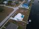 Aerial view of the house and its canal-side location at 174 Severin Se Rd, Port Charlotte, FL 33952