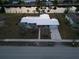 Overhead view of house, pool, and waterfront lot at 174 Severin Se Rd, Port Charlotte, FL 33952