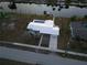 House with pool, located on a canal, close to other houses at 174 Severin Se Rd, Port Charlotte, FL 33952