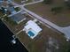 Property view from above, showing pool and canal access at 174 Severin Se Rd, Port Charlotte, FL 33952