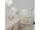 Bathroom with double vanity, quartz countertop, and shower at 174 Severin Se Rd, Port Charlotte, FL 33952