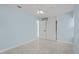 Bedroom with white closet and light blue walls at 174 Severin Se Rd, Port Charlotte, FL 33952