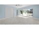 Bedroom with pool view and sliding glass doors at 174 Severin Se Rd, Port Charlotte, FL 33952