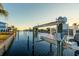 Private boat lift on a tranquil canal at 174 Severin Se Rd, Port Charlotte, FL 33952